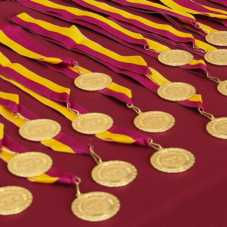 Honors Medallions on garnet table cloth on diagonal