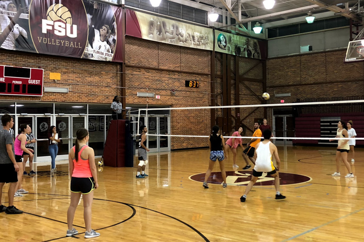 HEP Students Playing IM Volleyball in Gym