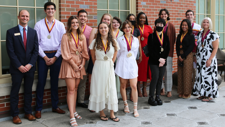 Summer 2021 Honors Medallion Ceremony Graduates Group Photo, including Dean Joe O'Shea pictured on the far left. Picture taken on balcony off the Great Hall in the Honors, Scholars, and Fellows House on July 27, 2021.